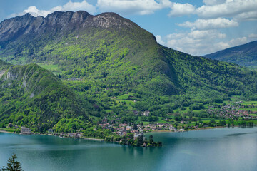 Fototapeta na wymiar beautiful view on french Alps at lake Annecy with Duingt village, France