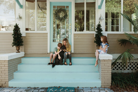 Family of Three On Their Steps