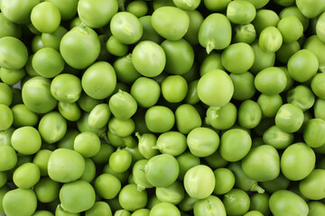 Green pea seeds on whole background, close up