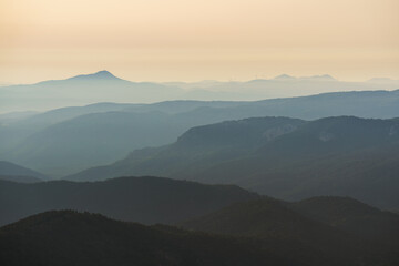 View of different gradient layers of mountains at dusk