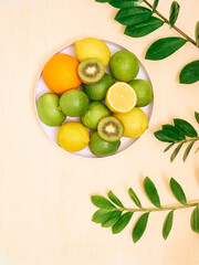 Composition with citrus fruits on blue background, top view.