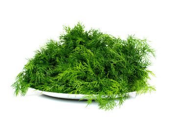A plate with a lot of dill on a white background