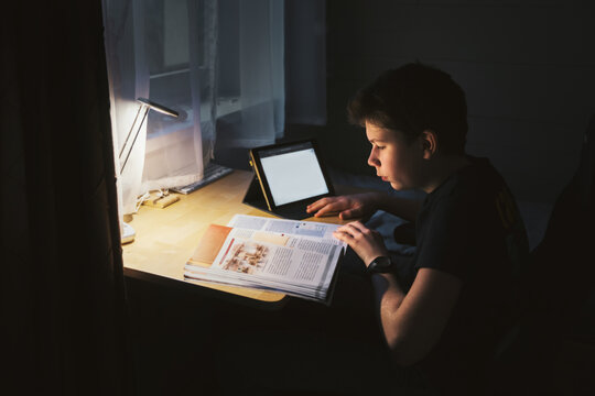 Boy learning at night 