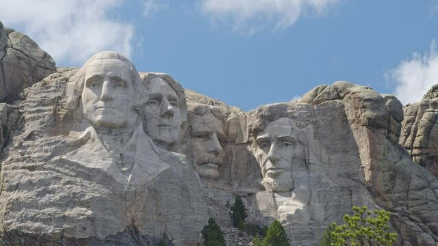 Clouds moving over Mount Rushmore on sunny day in at the monument.