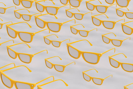 Yellow sunglasses on grey background
