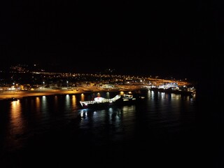 Aerial Night View Of Cruise Ships In Port Station Of Igoumenitsa City In Greece