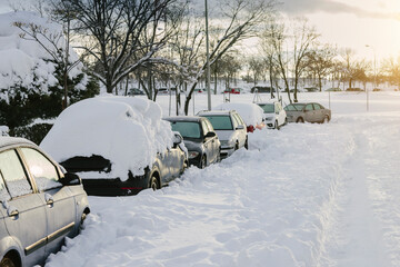 Winter scene with cars covered with snow during a historic snowfall in Madrid