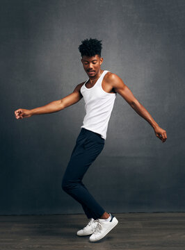A Handsome Kenyan-Filipino Man Dancing In Studio