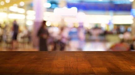 Fototapeta premium Empty wood table top and blur of night market background/selective focus .For montage product display.