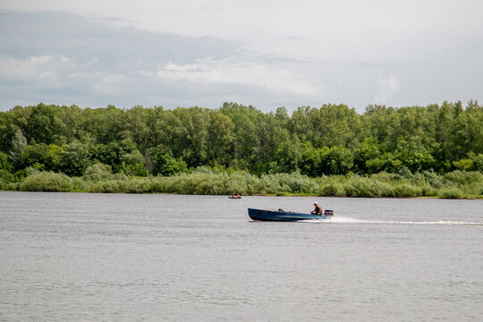 the motor boat goes along the river