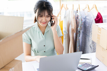 Young Asian woman starting a home-based online sales career