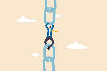 Supply chain problem, risk or vulnerability of industrial business, connection or management to hold chain together concept, fatigue businessman manager holding metal chain together.