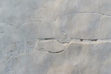 Compacted snow with rifts and cracks for the backdrop.