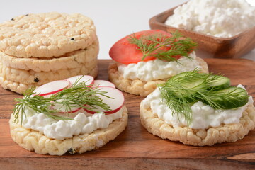 Rice bread Crispy bred Radish slices, tomatoes and cucumber  slices ,Cottage cheese and fresh dill