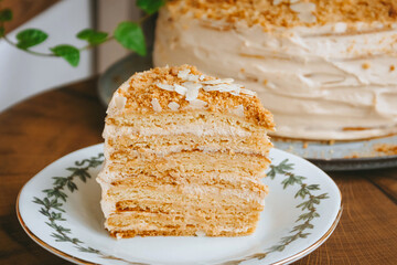 Home made Honey cake on a wooden table, Photo of a piece close-up