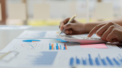 Financial businessmen Calculation of corporate income tax information And analyze the chart of financial shares that are in good condition with growth