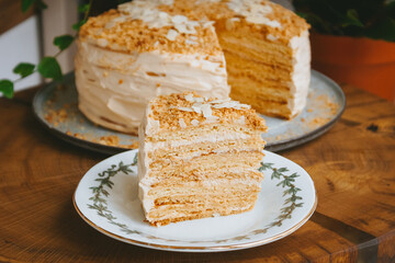 Home made Honey cake on a wooden table, Photo of a piece close-up