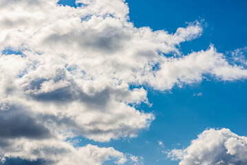White fluffy clouds in the blue sky background.Cloudy white blue sky in the nice blue heaven sky.