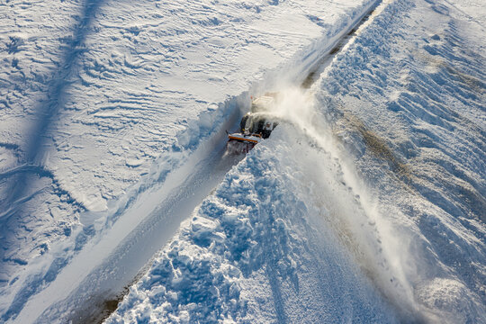 clearing the snow with a snow blower