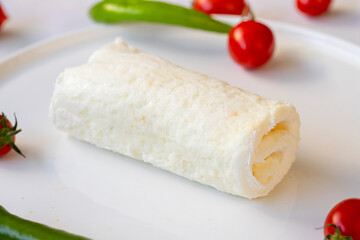 Clotted cream ( butter cream ) on a white plate. Turkish breakfast / Kaymak