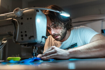 Modern entrepreneur using sewing machine