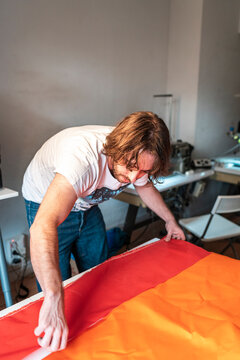 Textile designer using a bolt of fabric