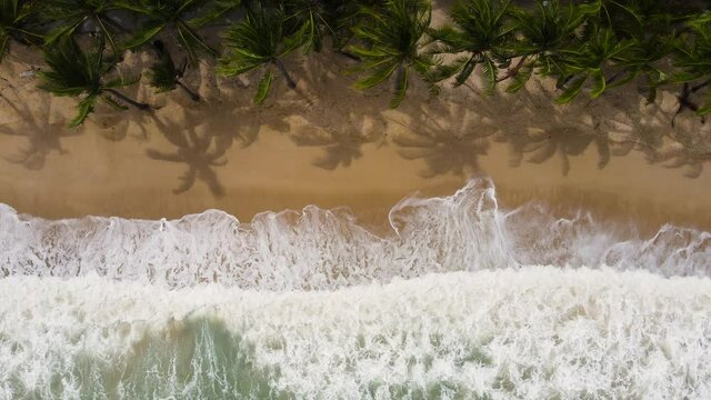 Beach sea in summer sun Aerial view Top-down shot. Phuket, Thailand 4K Nature and travel concept. Shot on drone high quality camera.