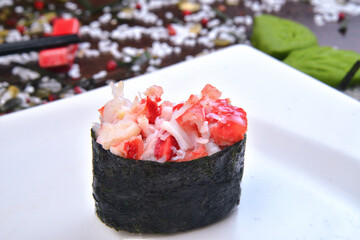 Spicy gunkan maki sushi with isolated on white background side view