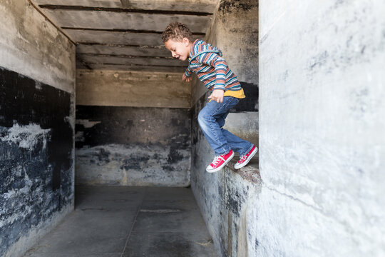 Boy jumps off ledge
