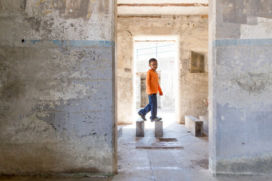Boy plays on concrete steps