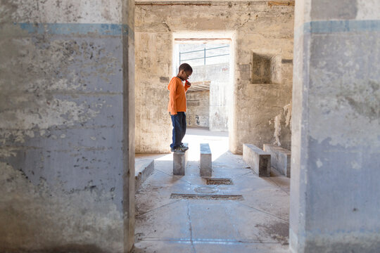 Boy walks on concrete steps