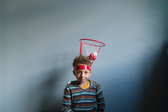 Cute boy with novelty basket hat