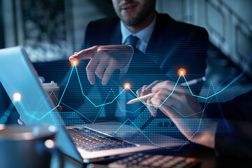 Two colleagues in formal wear working together to optimize trading strategy at corporate finance...