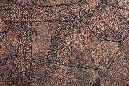 Brown fine polygon-textured leather. Natural expensive products