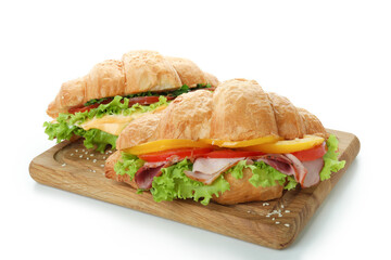 Board with croissant sandwiches isolated on white background