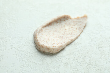 Skin care scrub on white textured background