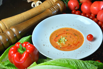 soup with ingredients on wood background