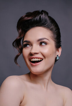 Funny brunette woman with amazing hairstyle