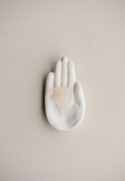 menstrual cup on hand