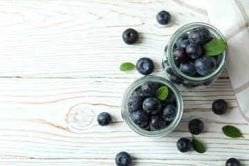 Fresh berry concept with blueberry on white wooden table