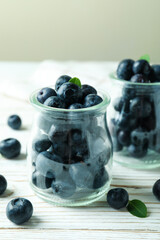 Fresh berry concept with blueberry on white wooden table