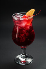red cocktail on a black background