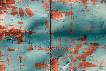 Old metal painted in blue with rust and chipped