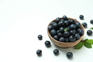 Fresh blueberry with leaves on white background