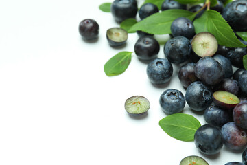 Fresh blueberry with leaves on white background