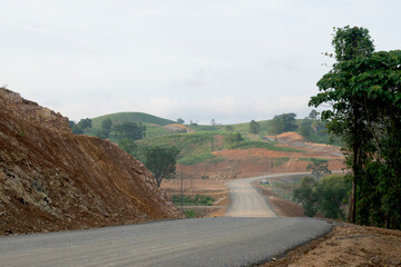 A view of a landscape with a golden evening sky.