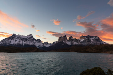 Naklejka na ściany i meble Sunrise and sunset scenery, majestic mountain peaks. Torres del Paine National Park, a popular travel destination in Chile. The stunning natural scenery of South America.