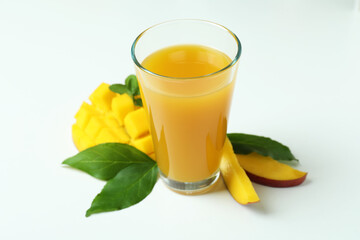 Mango juice and fruit on white background