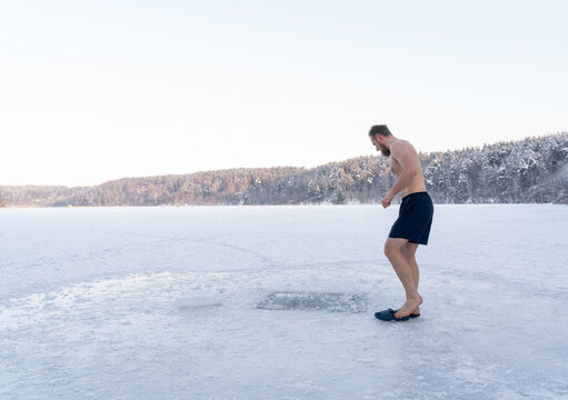 Man Going To Enter To Ice Hole