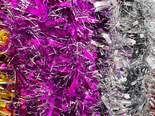 Colorful ribbon and bell,silver decoration on a background.